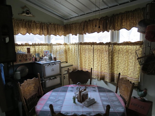 dining space with lofted ceiling