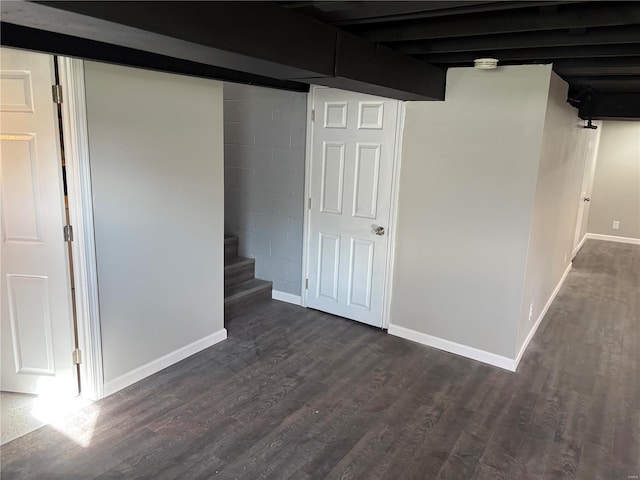 basement featuring dark wood-type flooring