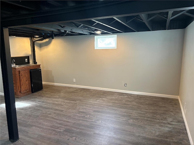 basement with dark wood-type flooring