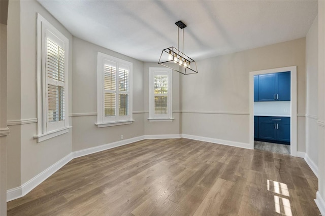 unfurnished dining area with a healthy amount of sunlight and light hardwood / wood-style floors