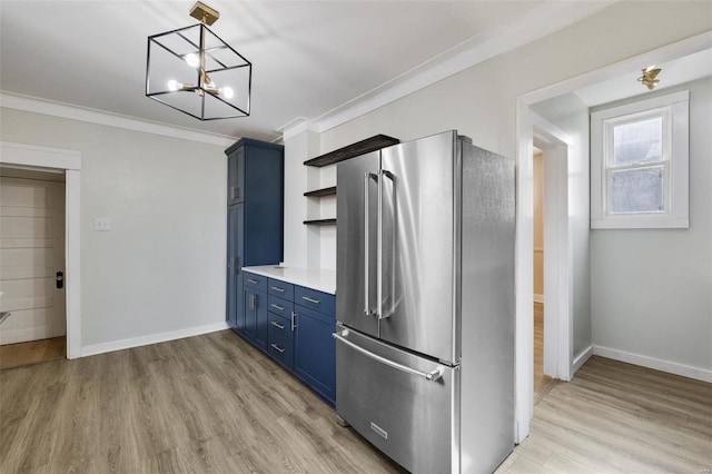 kitchen featuring pendant lighting, blue cabinets, crown molding, light wood-type flooring, and high quality fridge