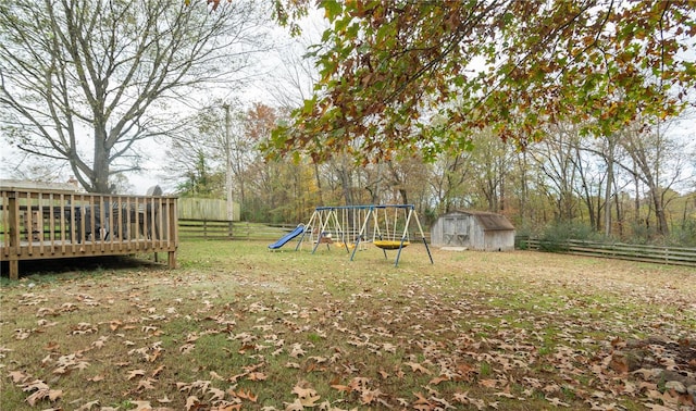 view of yard with a storage unit and a playground