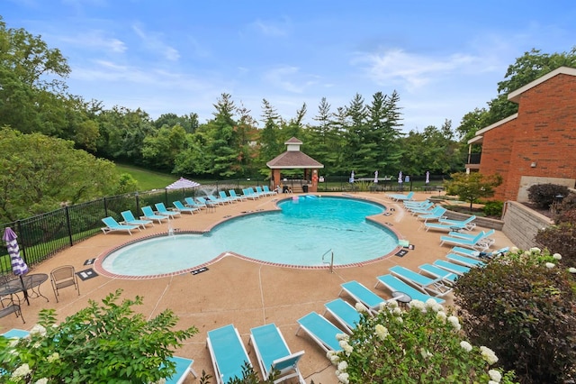 view of swimming pool with a gazebo and a patio