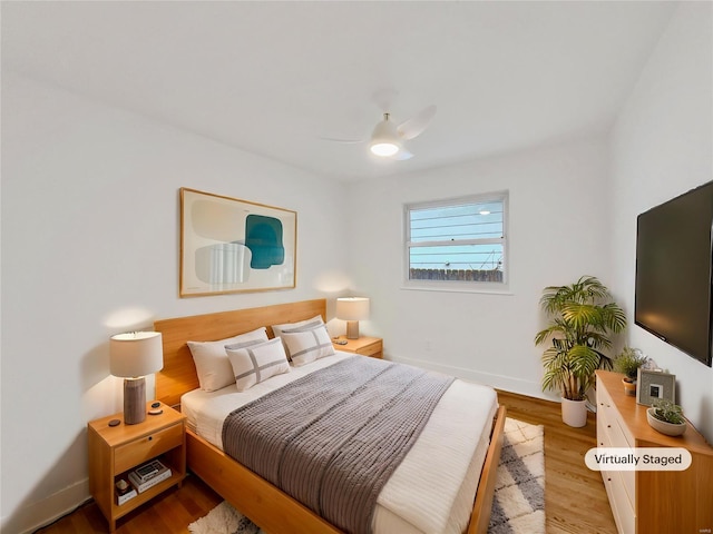 bedroom featuring ceiling fan and light hardwood / wood-style floors