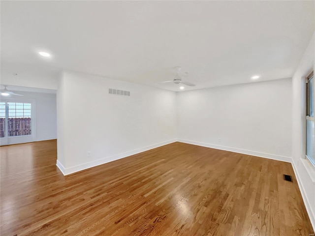 unfurnished room featuring ceiling fan and hardwood / wood-style flooring