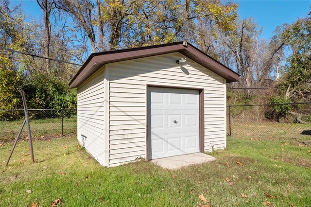 view of outdoor structure with a lawn