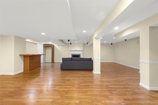 unfurnished living room featuring light wood-type flooring