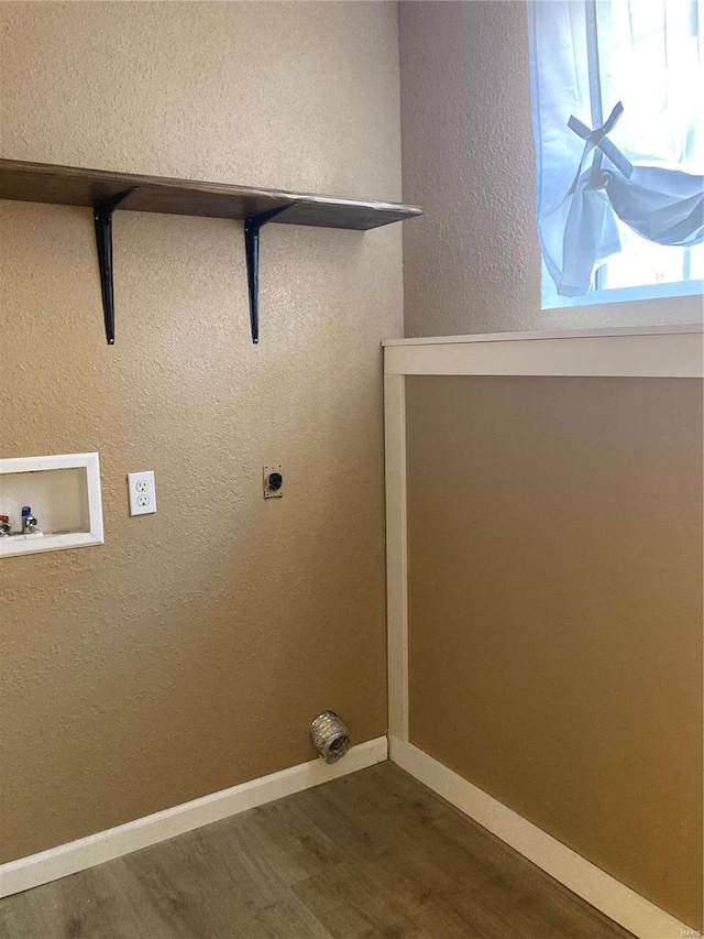 laundry room with hookup for a washing machine, dark hardwood / wood-style flooring, and electric dryer hookup