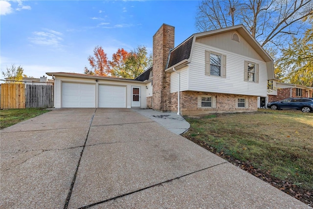 view of front of property with a garage and a front lawn