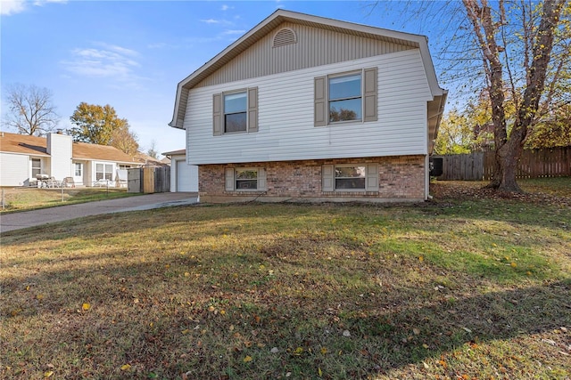 exterior space featuring a front lawn and a garage