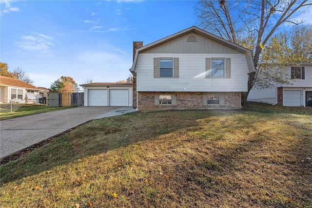 view of front of house featuring a front yard and a garage