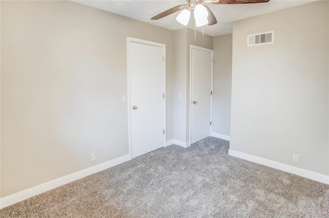 unfurnished bedroom with ceiling fan and light carpet