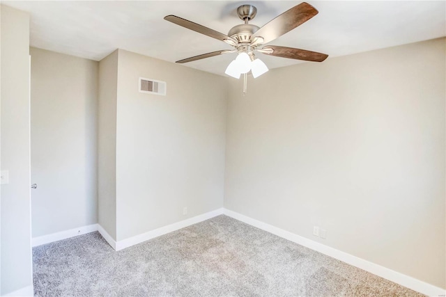 unfurnished room featuring light carpet and ceiling fan