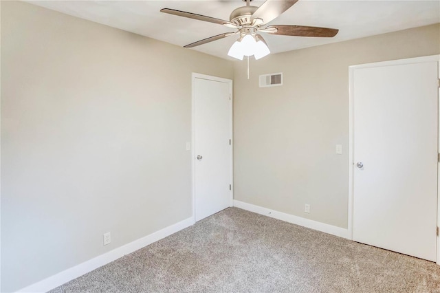 carpeted empty room with ceiling fan