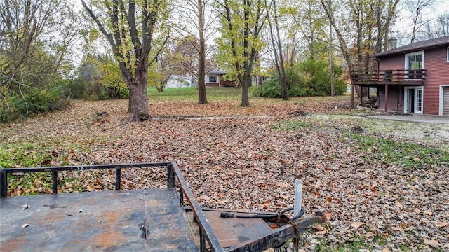 view of yard featuring a patio area and a deck