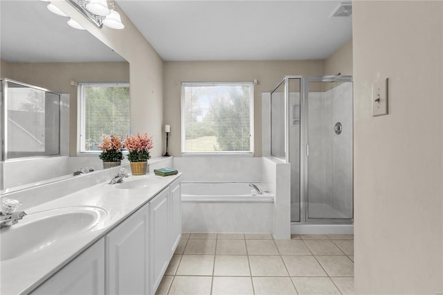 bathroom with tile patterned floors, vanity, and independent shower and bath