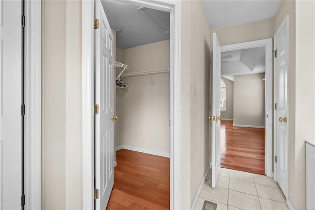 spacious closet featuring light hardwood / wood-style floors