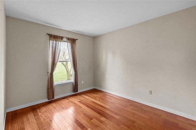 unfurnished room featuring light hardwood / wood-style floors