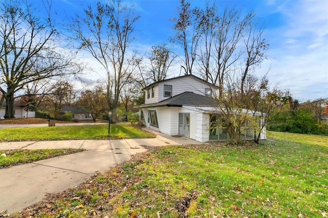 view of home's exterior with a yard