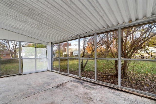 unfurnished sunroom with lofted ceiling