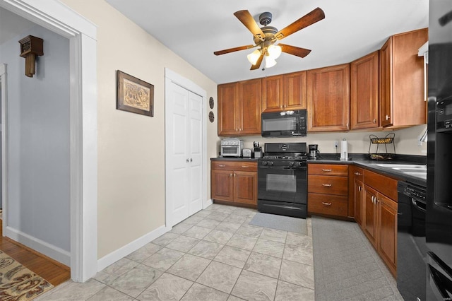 kitchen with ceiling fan and black appliances