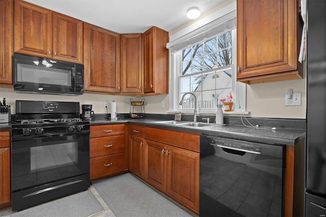 kitchen featuring sink and black appliances