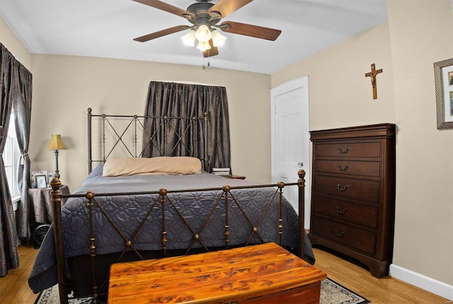 bedroom featuring ceiling fan and light hardwood / wood-style flooring