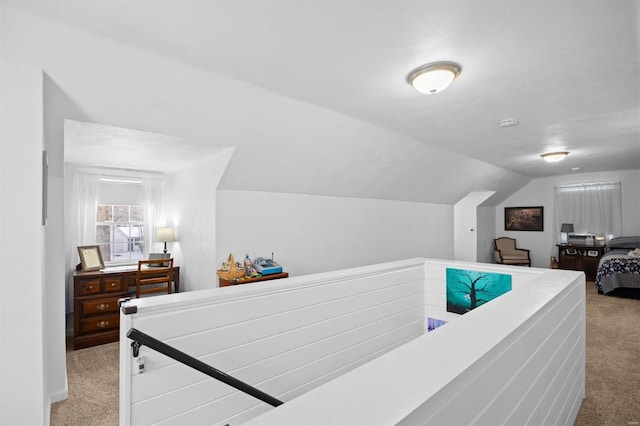 carpeted bedroom featuring lofted ceiling