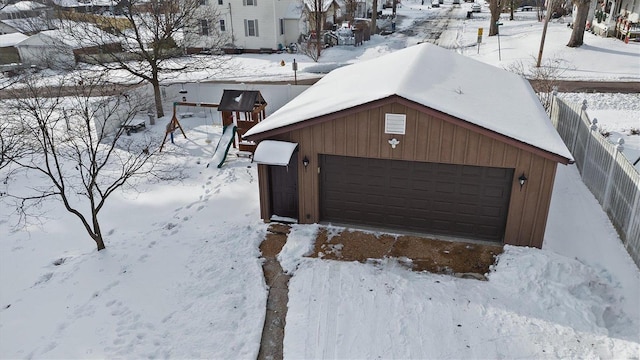 view of snow covered garage