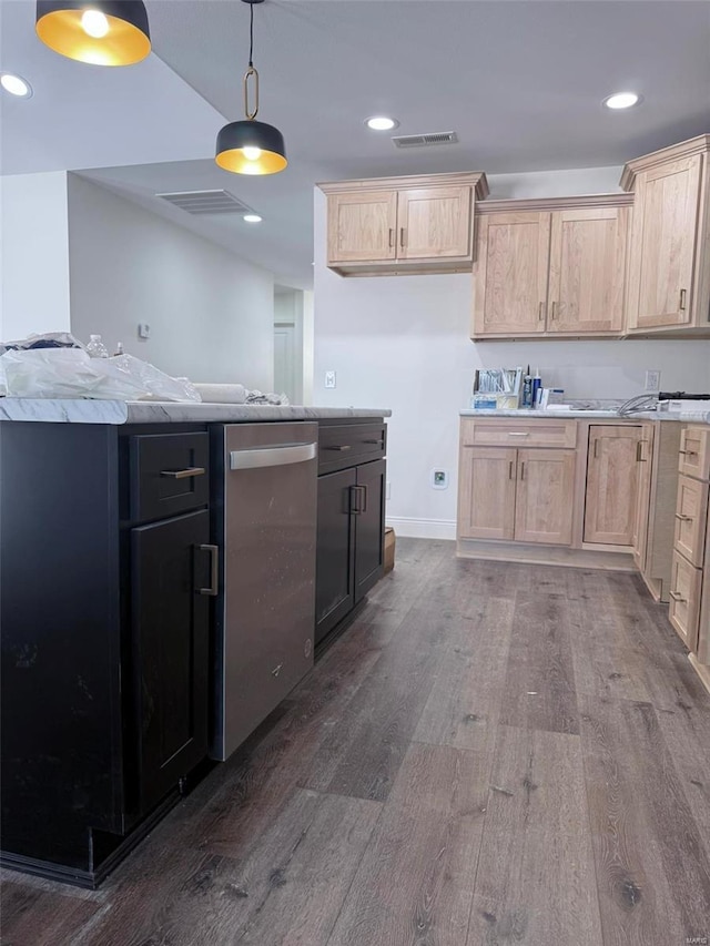 kitchen with light countertops, visible vents, and light brown cabinetry