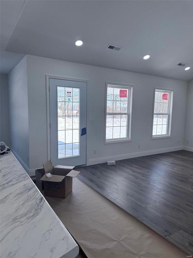 doorway to outside with recessed lighting, dark wood-style flooring, visible vents, and baseboards