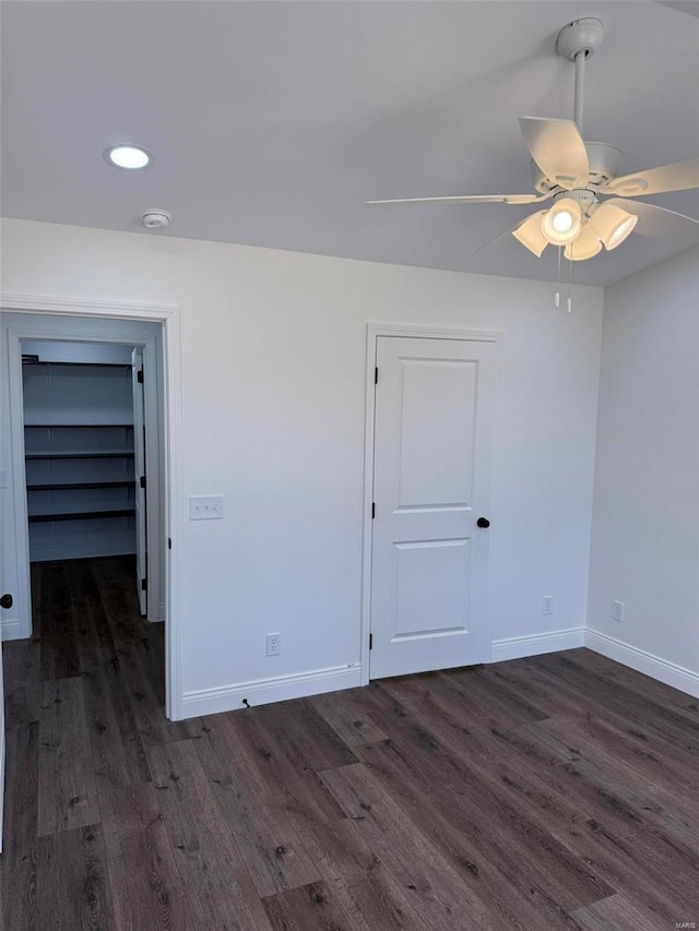 empty room featuring recessed lighting, ceiling fan, baseboards, and wood finished floors