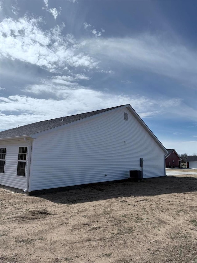 view of property exterior featuring central AC