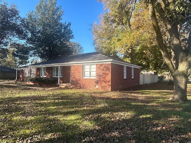 view of home's exterior featuring a yard