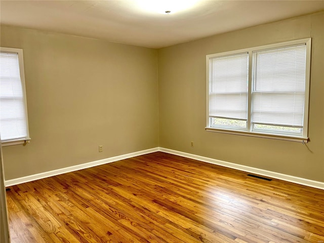 empty room featuring hardwood / wood-style floors