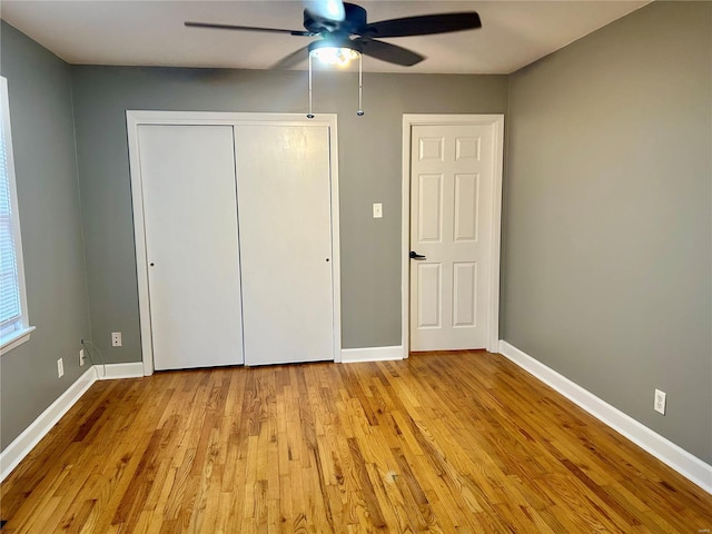 unfurnished bedroom with light hardwood / wood-style floors and ceiling fan