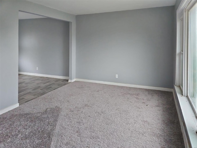 unfurnished room featuring dark hardwood / wood-style floors