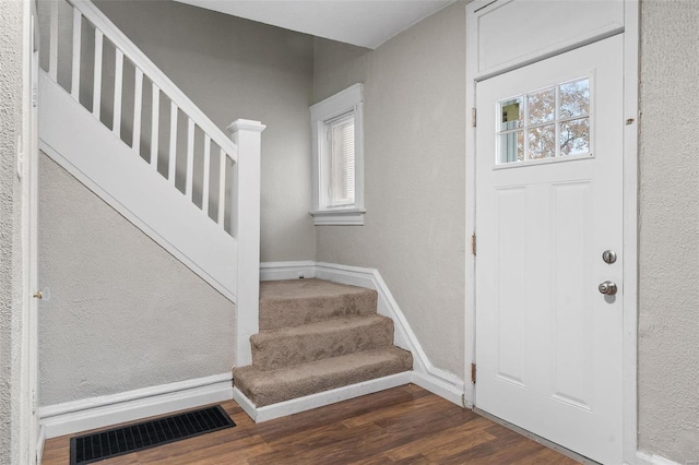 foyer entrance featuring dark hardwood / wood-style flooring