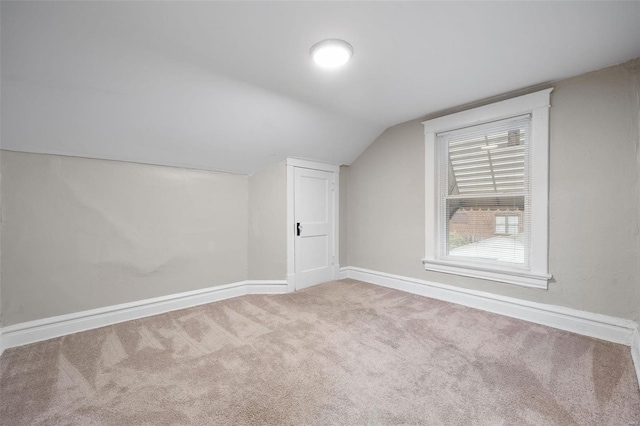 bonus room with carpet and lofted ceiling