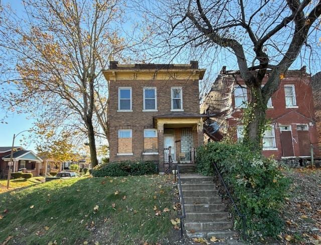 italianate home with a front yard