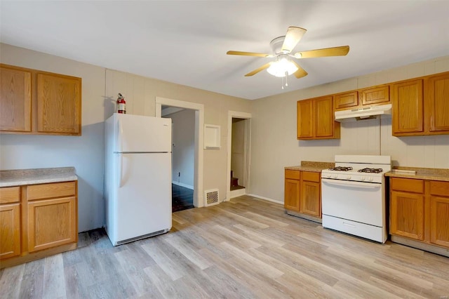 kitchen featuring ceiling fan, light hardwood / wood-style flooring, and white appliances