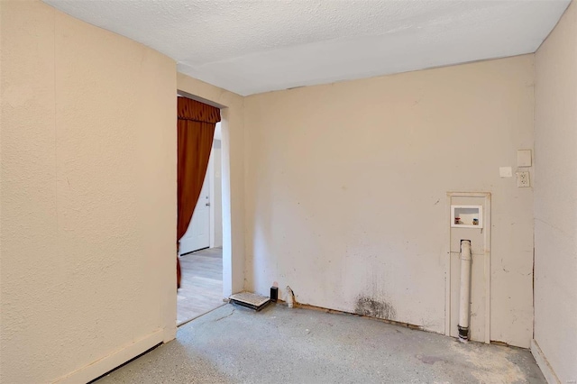 empty room with a textured ceiling