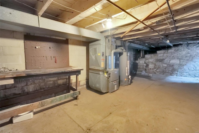 basement with gas water heater and heating unit