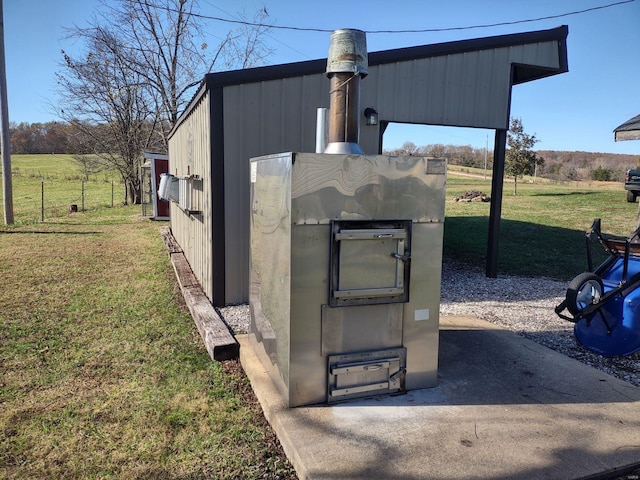 view of storm shelter featuring a yard