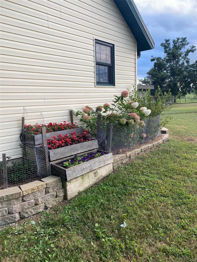 view of property exterior with a lawn