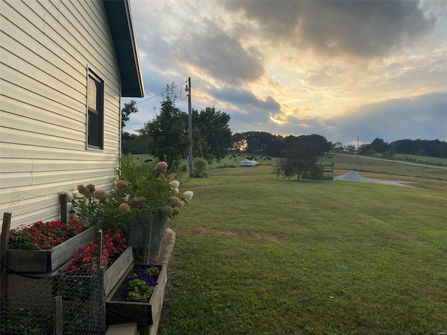 view of yard at dusk