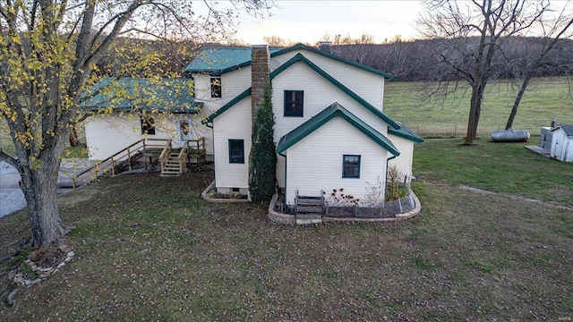 view of side of home featuring a lawn