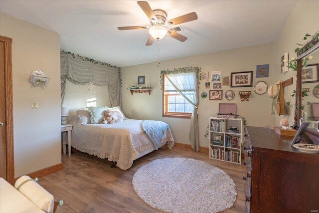 bedroom featuring ceiling fan and hardwood / wood-style flooring