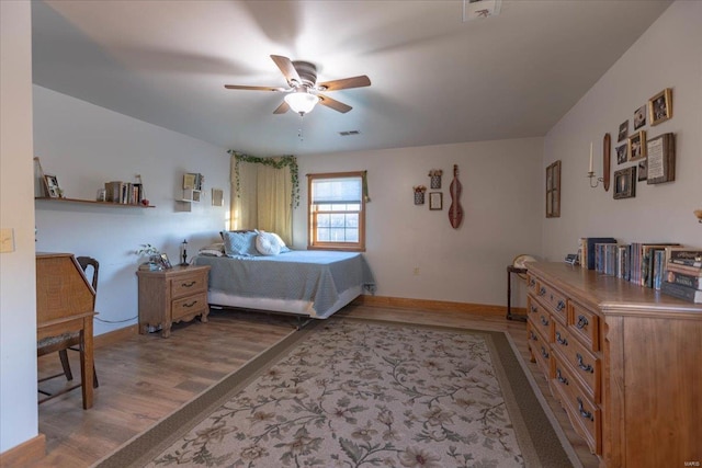 bedroom featuring hardwood / wood-style floors and ceiling fan