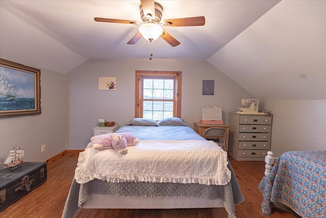 bedroom with ceiling fan, hardwood / wood-style floors, and lofted ceiling